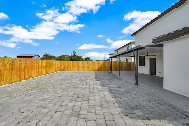 view of patio / terrace with ceiling fan and a fenced backyard