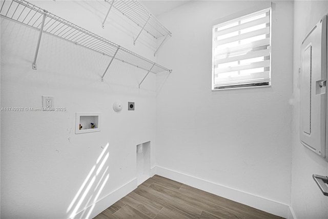 laundry room featuring laundry area, washer hookup, wood finished floors, baseboards, and electric dryer hookup