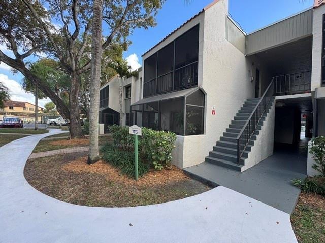 view of building exterior featuring stairs