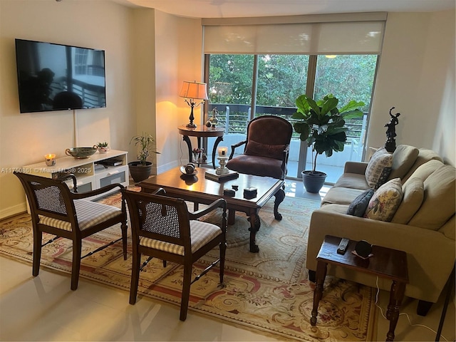 living room with a wealth of natural light and baseboards