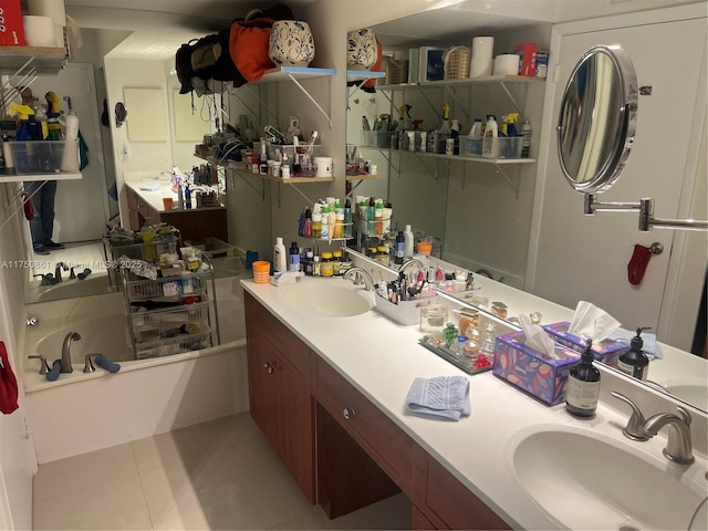 full bath featuring a workshop area, vanity, and tile patterned floors