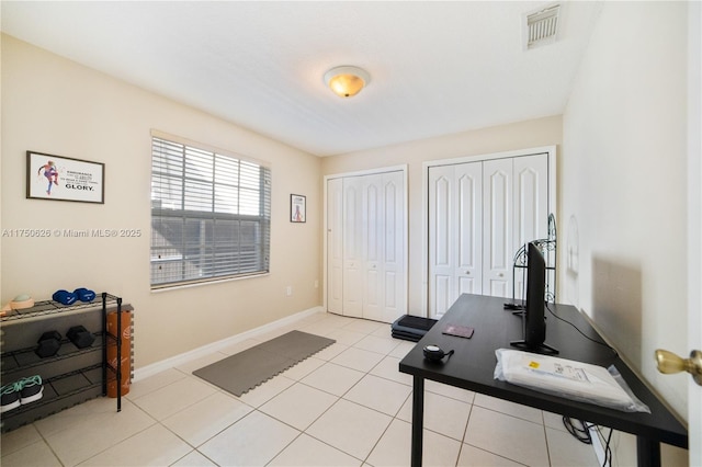 office area with visible vents, baseboards, and light tile patterned floors