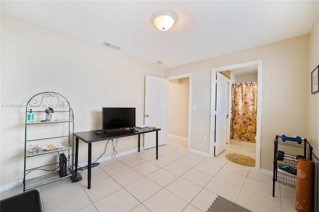 home office with visible vents, baseboards, and light tile patterned floors