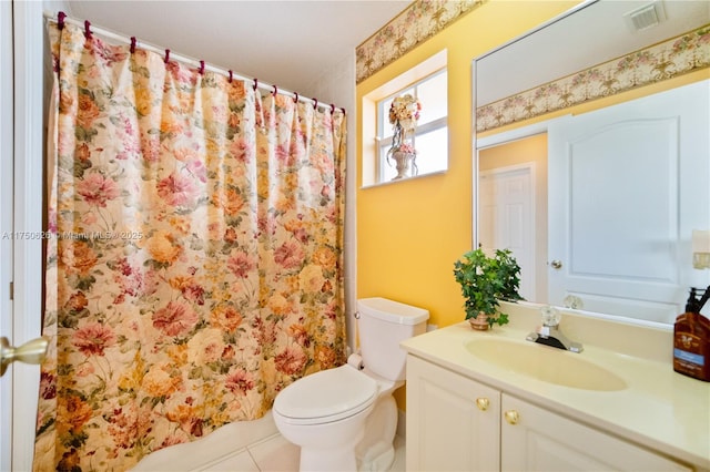 full bath featuring toilet, vanity, visible vents, and tile patterned floors