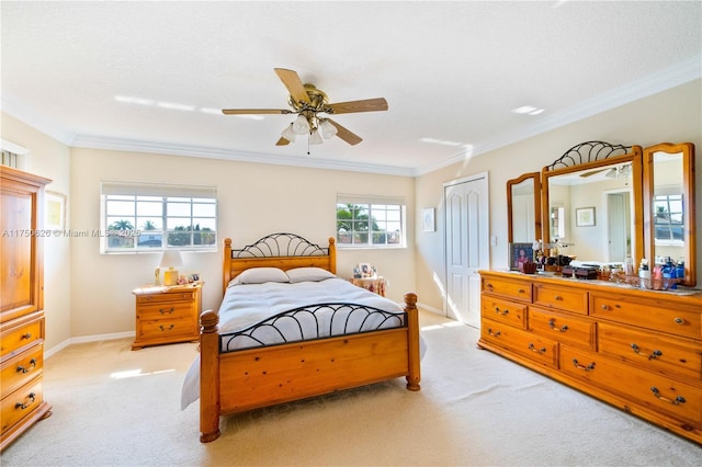 bedroom with ornamental molding, light carpet, and baseboards