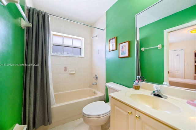 full bathroom with toilet, shower / bath combo with shower curtain, and vanity