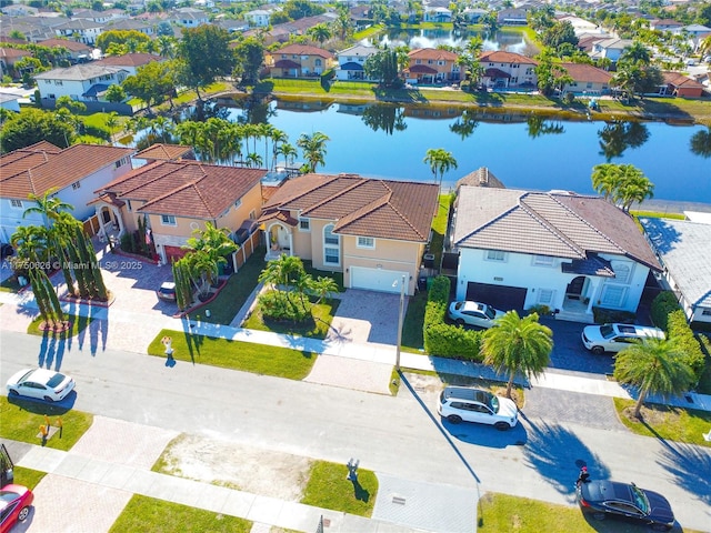 aerial view featuring a residential view and a water view