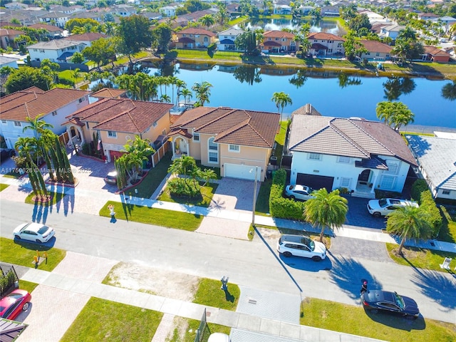 aerial view featuring a residential view and a water view