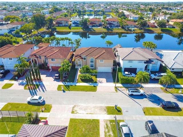 bird's eye view with a water view and a residential view