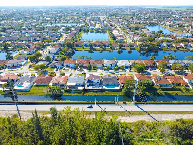 aerial view with a residential view and a water view