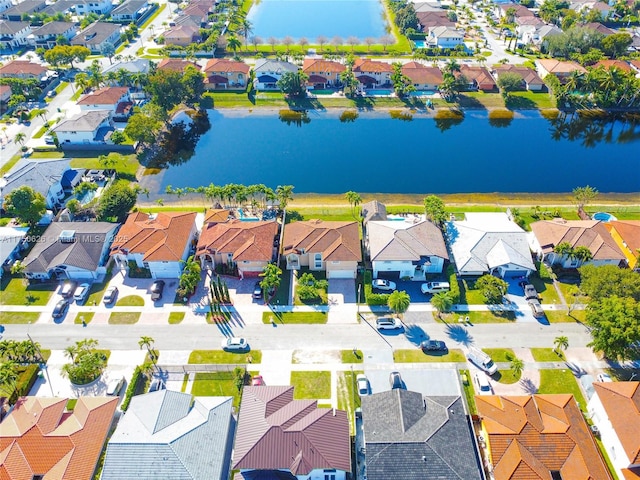 bird's eye view featuring a water view and a residential view