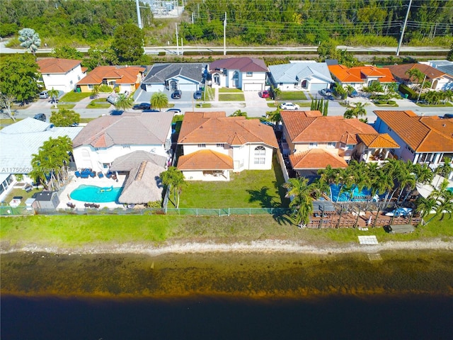 aerial view with a water view and a residential view