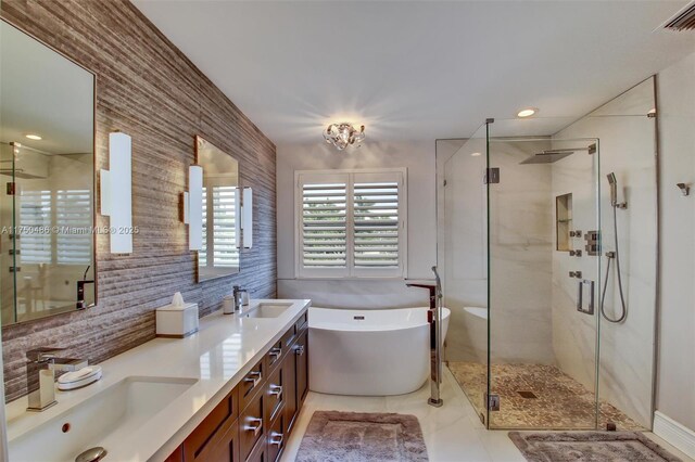 3962 Pinewood Ln, Weston, FL 33331 - bathroom featuring a freestanding tub, a stall shower, double vanity, and decorative backsplash