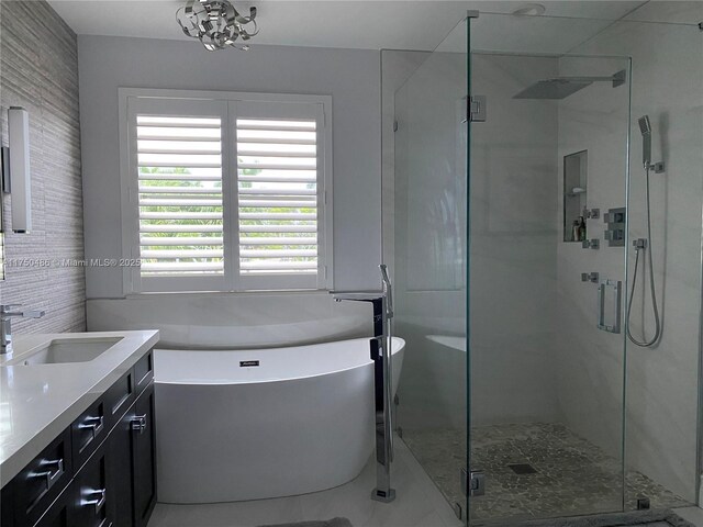 3962 Pinewood Ln, Weston, FL 33331 - full bath featuring vanity, a stall shower, and a soaking tub