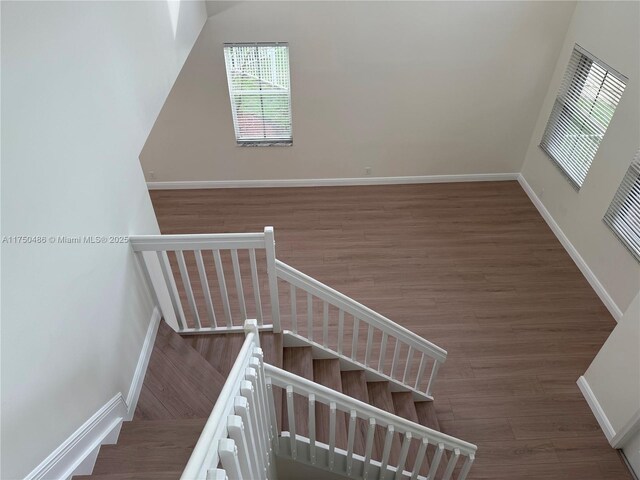 3962 Pinewood Ln, Weston, FL 33331 - staircase featuring wood finished floors and baseboards