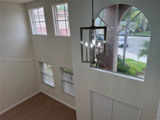 3962 Pinewood Ln, Weston, FL 33331 - entryway featuring wood finished floors, baseboards, and a high ceiling
