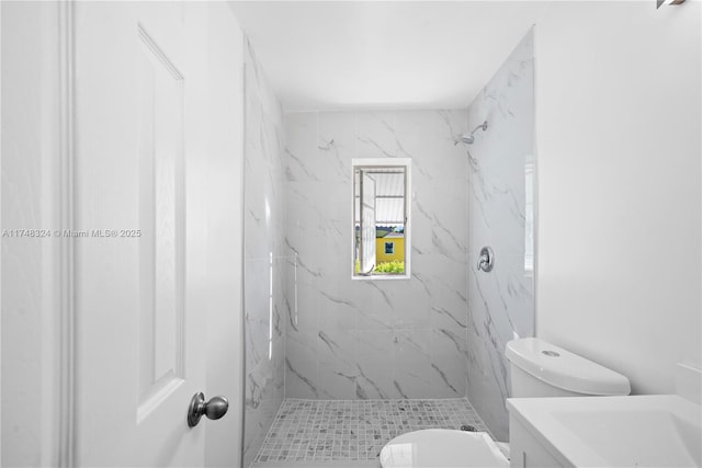 full bath featuring toilet, a marble finish shower, and vanity