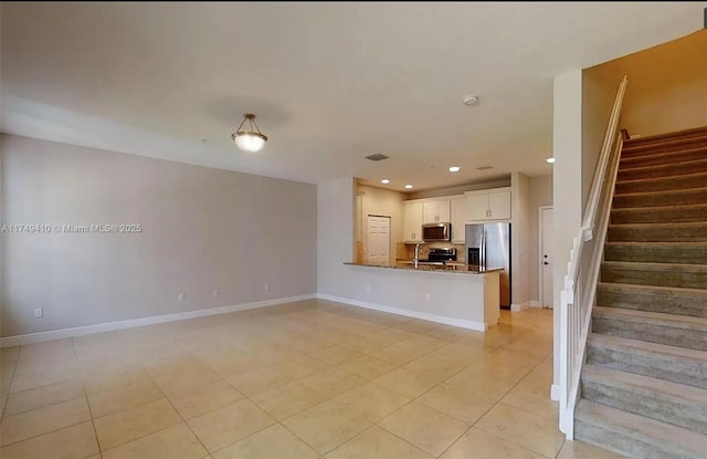 unfurnished living room with light tile patterned floors, recessed lighting, visible vents, stairway, and baseboards