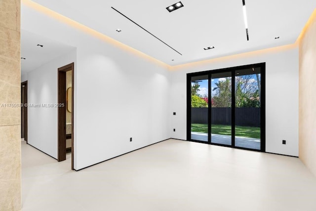 empty room featuring finished concrete flooring