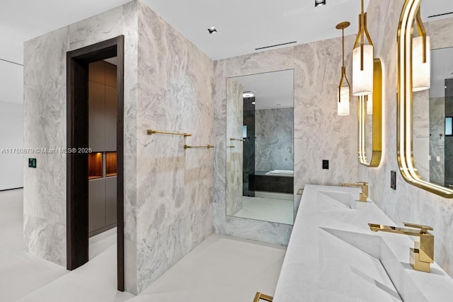 bathroom featuring a sink and double vanity