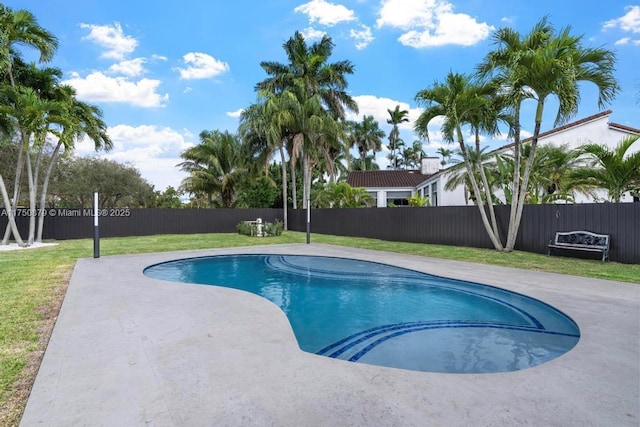 view of pool with a yard, a patio area, a fenced backyard, and a fenced in pool