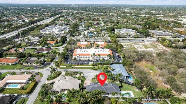 birds eye view of property with a residential view