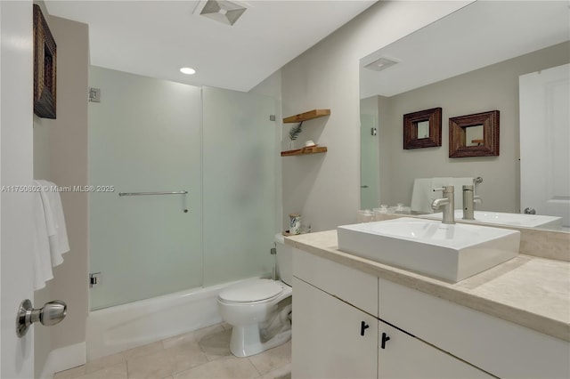 bathroom with shower / bath combination with glass door, visible vents, toilet, vanity, and tile patterned floors