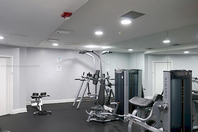 exercise room featuring recessed lighting, visible vents, and baseboards