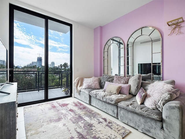 living room with a view of city, expansive windows, and tile patterned flooring