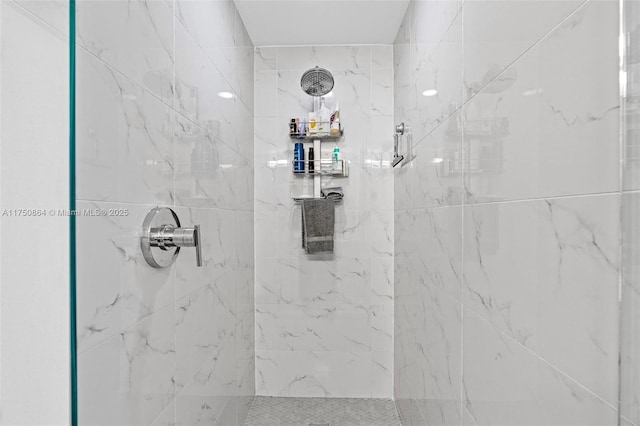 bathroom with tiled shower