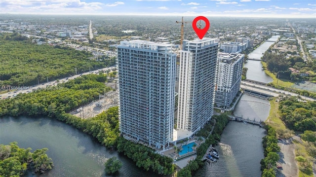 birds eye view of property featuring a view of city and a water view