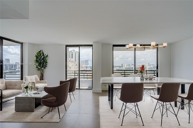 dining room featuring a wall of windows and a city view