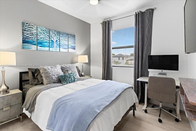 bedroom featuring wood finished floors