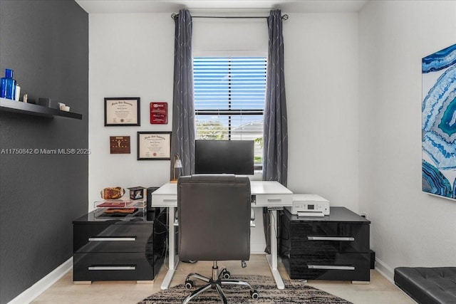 office area featuring baseboards