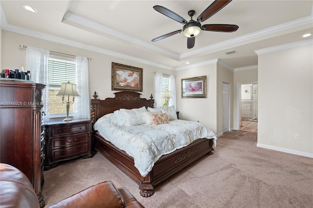bedroom with crown molding, visible vents, baseboards, a raised ceiling, and carpet