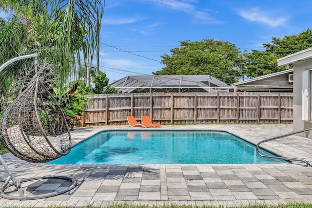 view of pool featuring a fenced in pool, a patio area, and fence