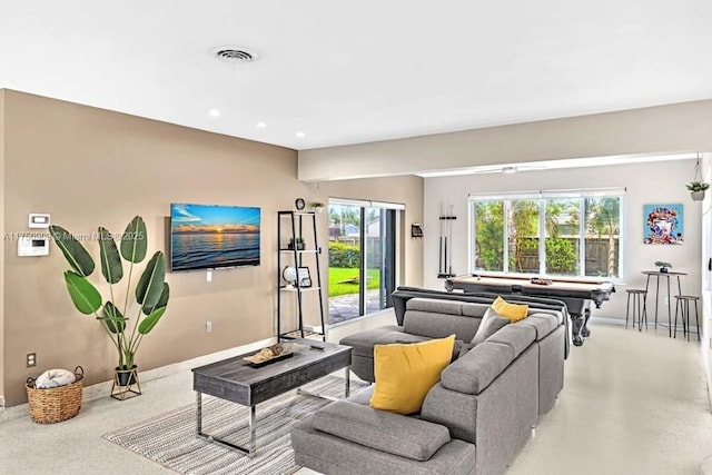 living area with visible vents and recessed lighting