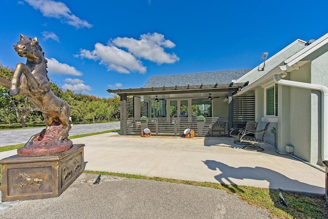 view of patio with ceiling fan