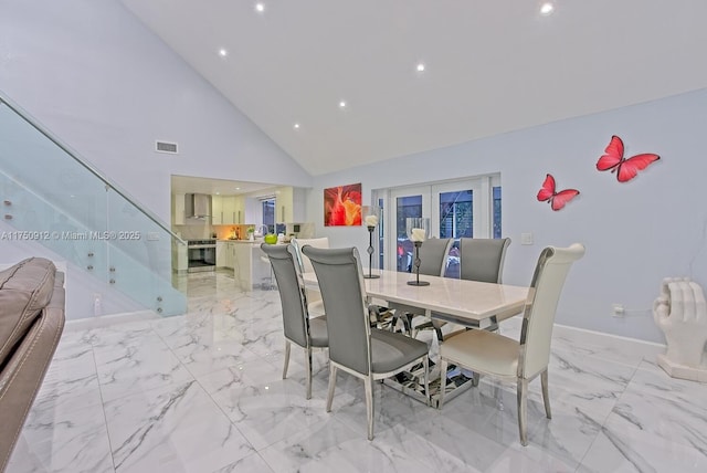 dining space with high vaulted ceiling, visible vents, baseboards, marble finish floor, and french doors