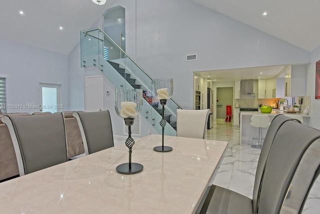 dining area with visible vents, stairway, marble finish floor, high vaulted ceiling, and recessed lighting