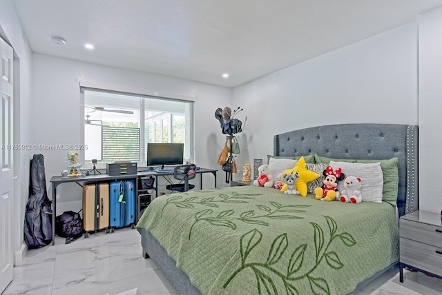 bedroom featuring marble finish floor and recessed lighting