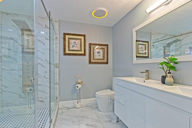 full bathroom featuring marble finish floor, a marble finish shower, toilet, a sink, and baseboards