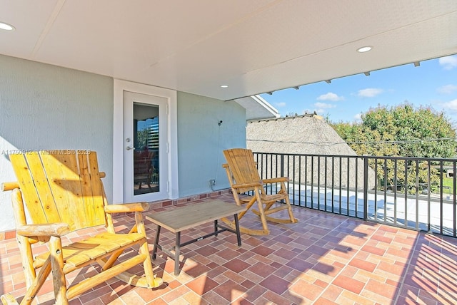 view of patio featuring a balcony