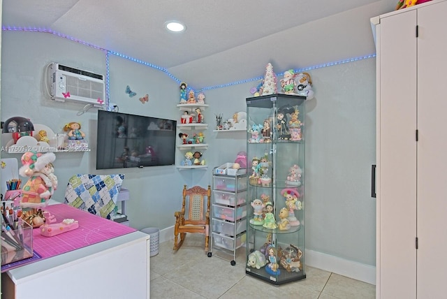 bedroom with light tile patterned floors, baseboards, lofted ceiling, an AC wall unit, and recessed lighting