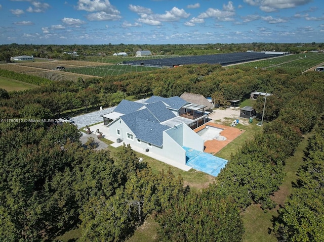 birds eye view of property featuring a rural view