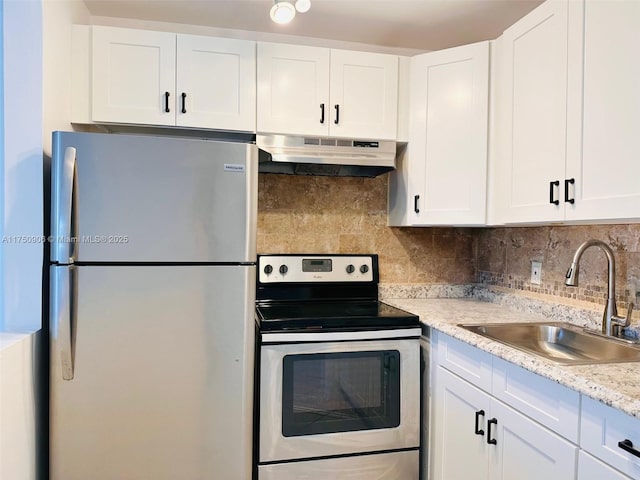 kitchen featuring appliances with stainless steel finishes, a sink, white cabinetry, and under cabinet range hood