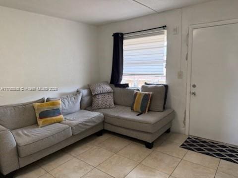 living area featuring light tile patterned flooring