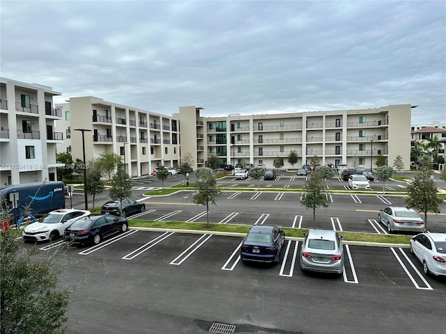 view of property featuring uncovered parking