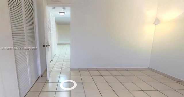 corridor featuring light tile patterned floors