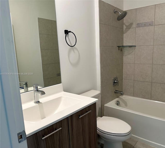 bathroom with toilet, tile patterned flooring,  shower combination, and vanity